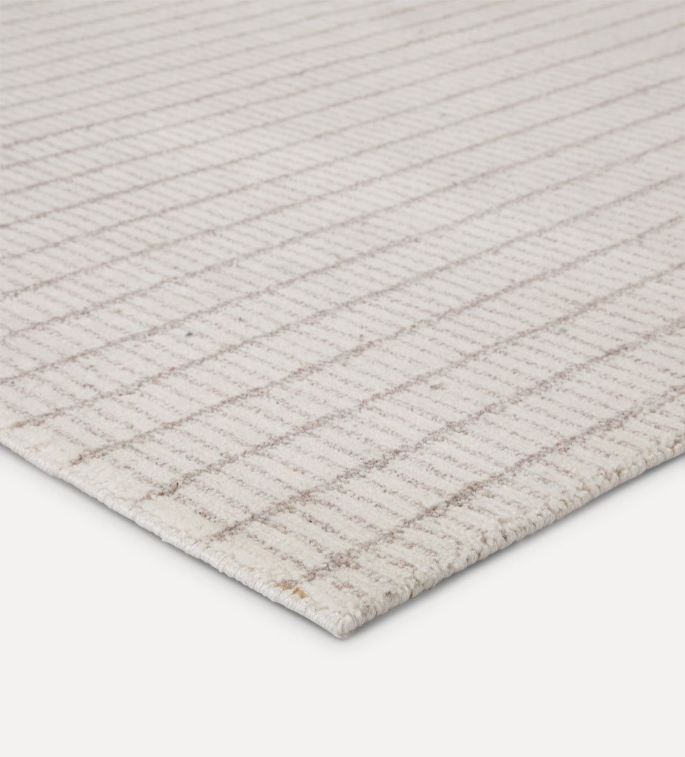 cream plaid-like pattern rug